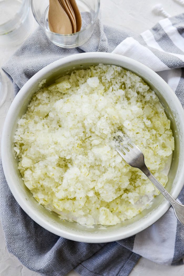 Gin and tonic granita scraped one last time with a fork before serving.