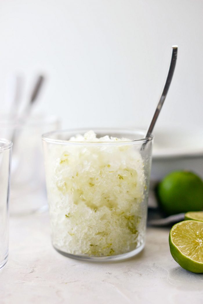 glass of gin and tonic granita with spoon