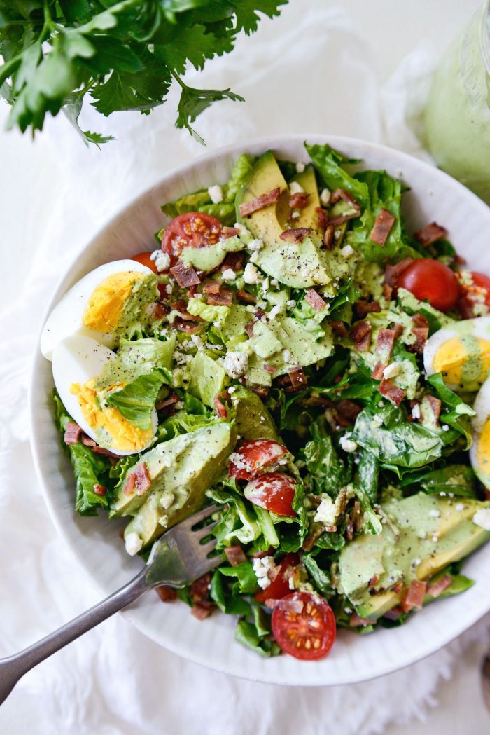 forkful of cobb salad with greek yogurt Green Goddess salad dressing.