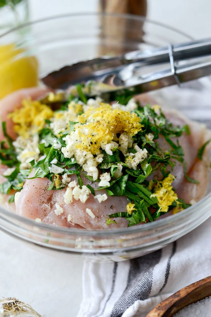 chicken, basil, garlic, salt and pepper, lemon juice and zest and olive oil in a bowl