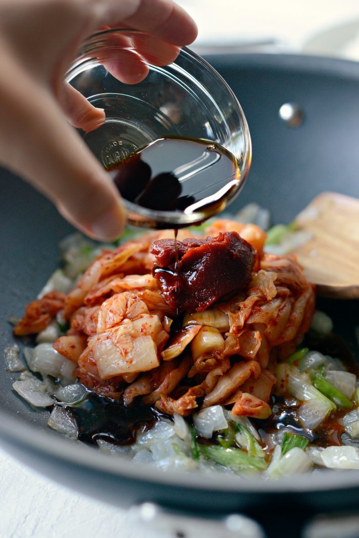 soy sauce, toasted sesame oil, white pepper and gochujang added to wok