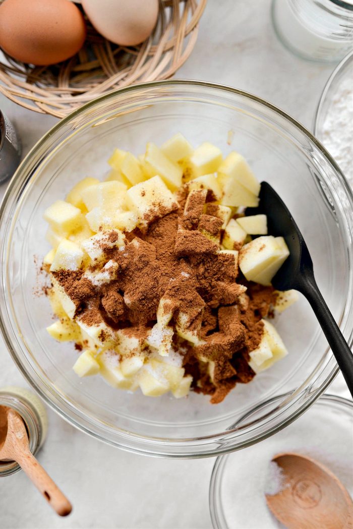 apples, cinnamon and sugar in a bowl