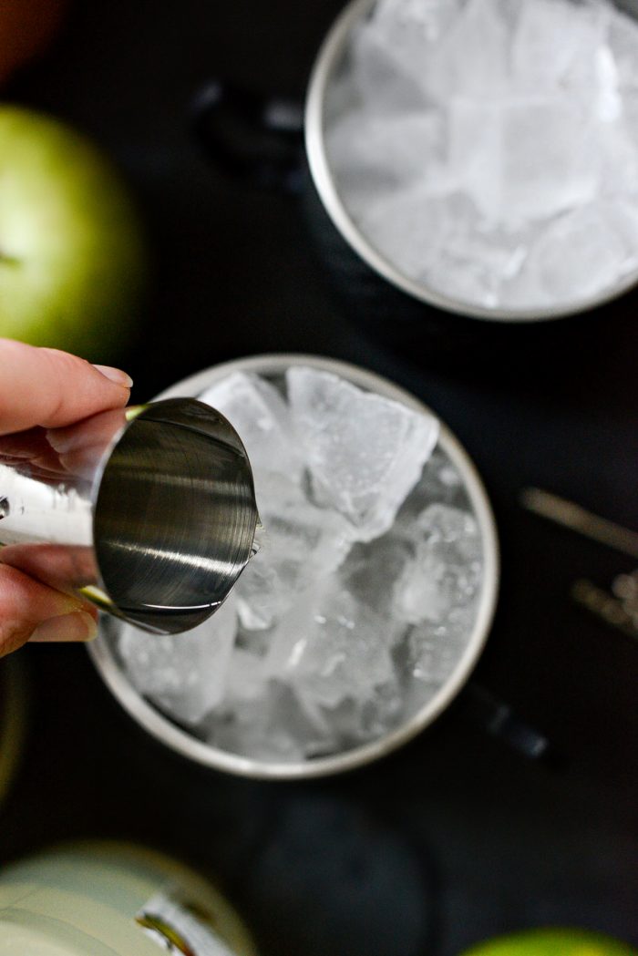 pouring in apple vodka