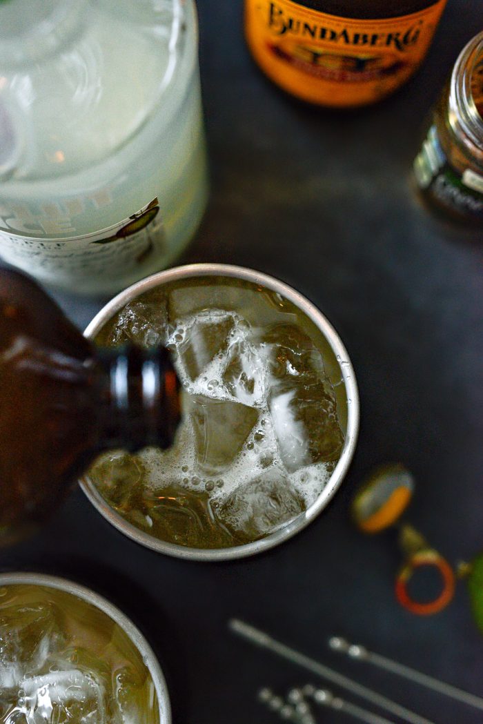 lastly pouring in ginger beer.