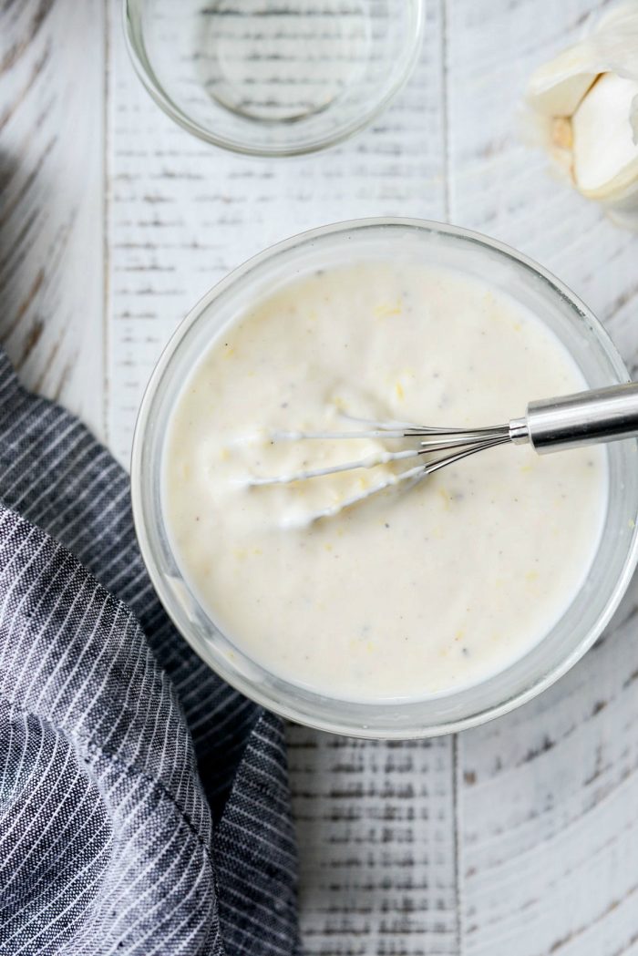 aioli whisked in glass bowl