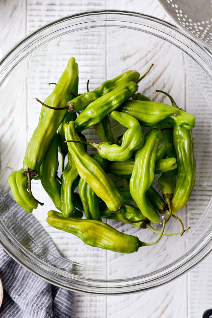 shishito peppers in a glass bowl