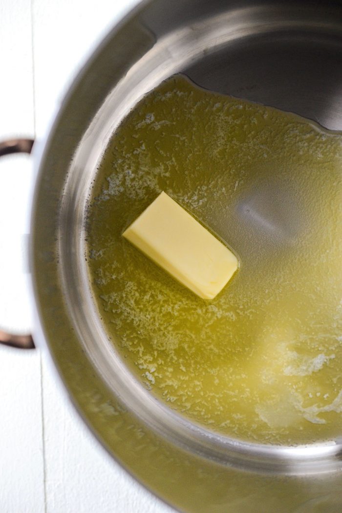 butter melting in a stainless steel pot