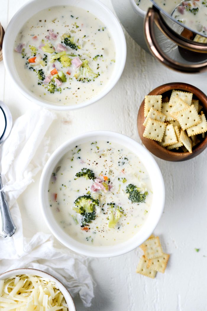 ladled Broccoli Ham and Swiss Soup in creamy white bowls.