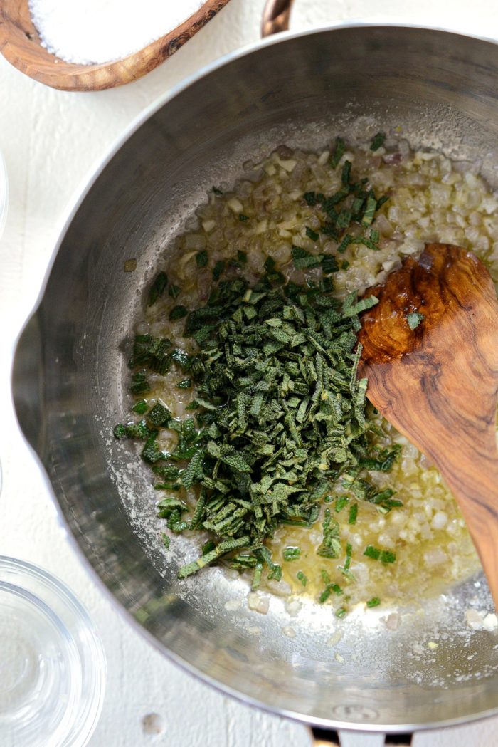 sage added to sauteed shallots and garlic