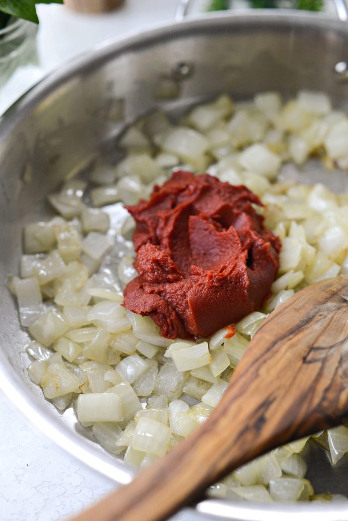 add tomato paste to skillet.
