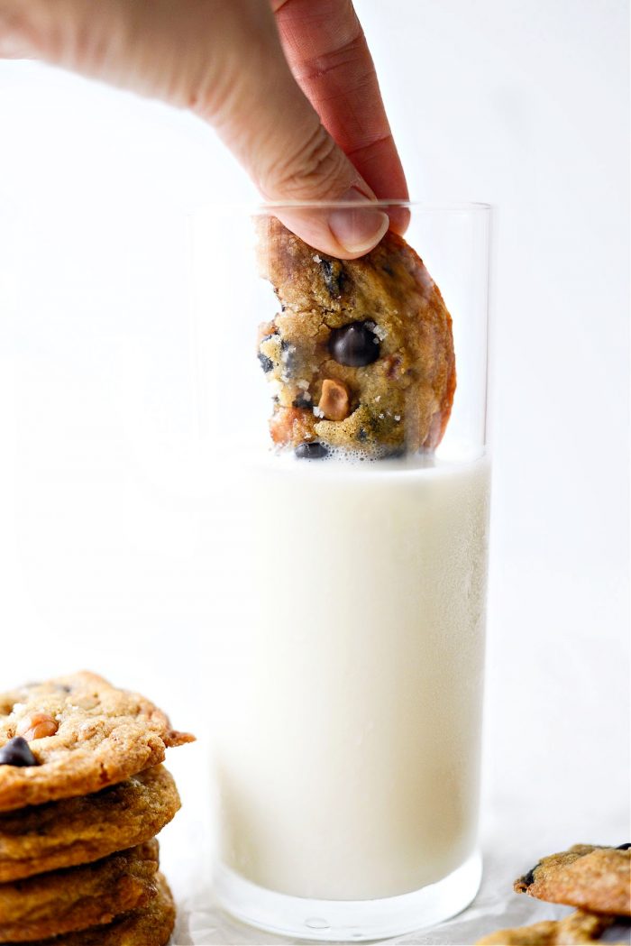 Salted Caramel Espresso Hazelnut Cookies dunked in a glass of milk