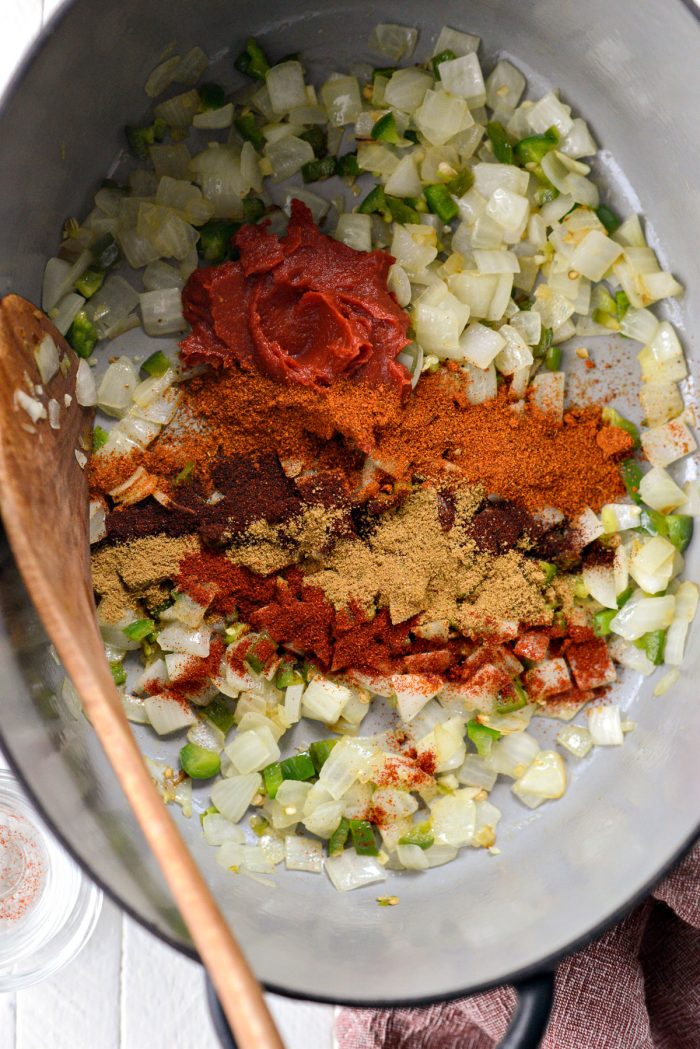 tomato paste and spices in the pot
