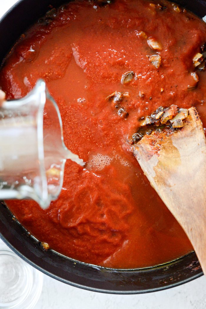 pouring broth into pot