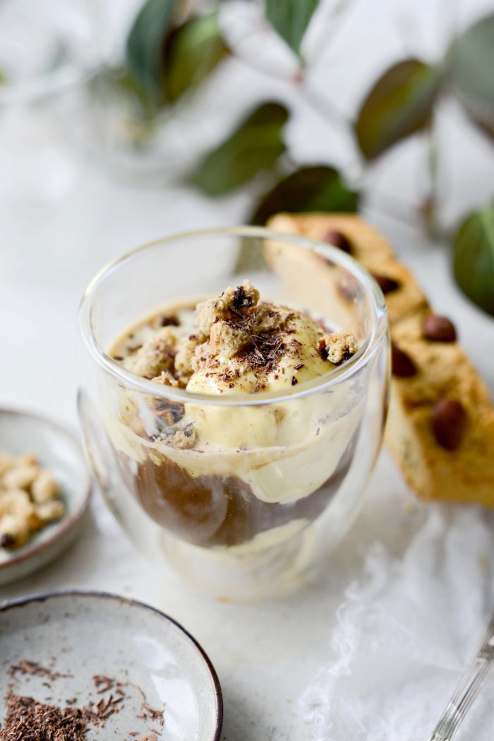 garnish affogato with crushed biscotti and chocolate shavings.