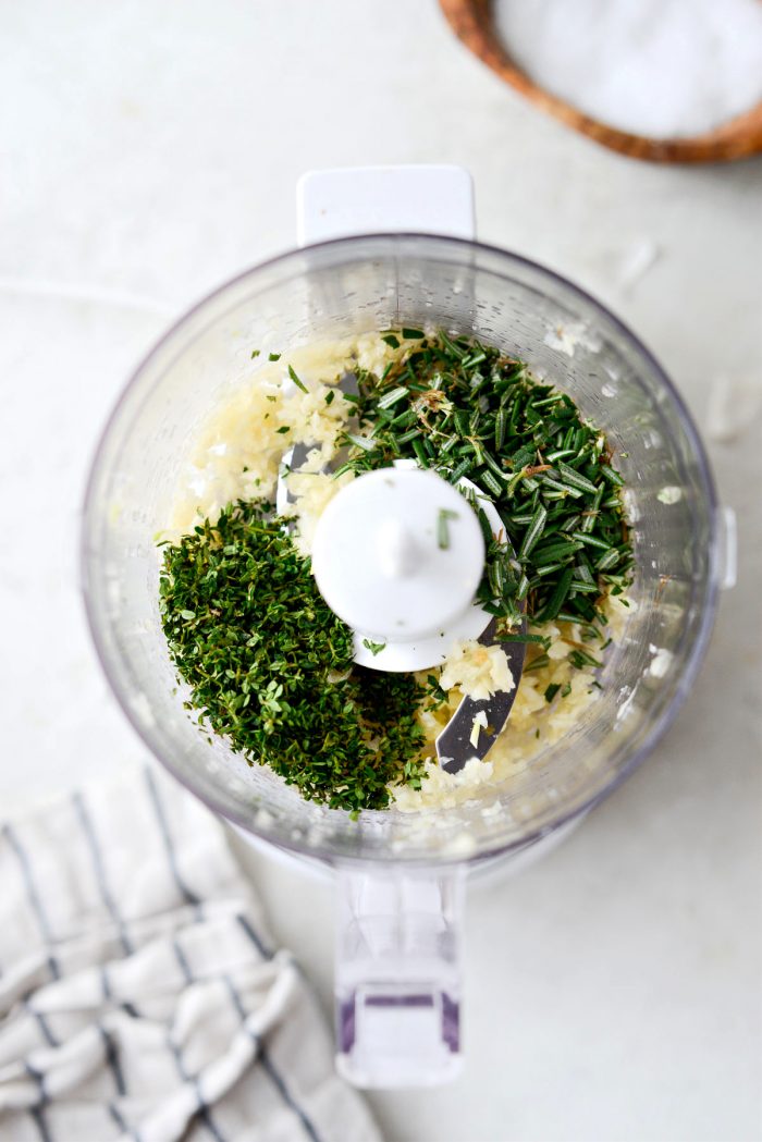 chopped fresh thyme and rosemary in mini food processor.