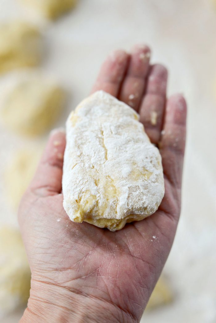 3 ounces of dough dusted with flour.