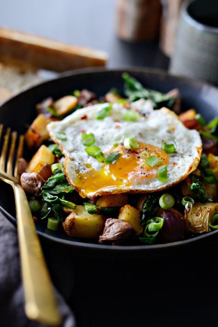 broken yolk of fried egg running over Leftover Prime Rib Breakfast Hash.