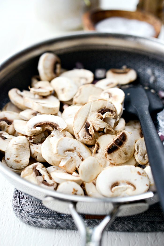 Sliced mushrooms added to onions and garlic.