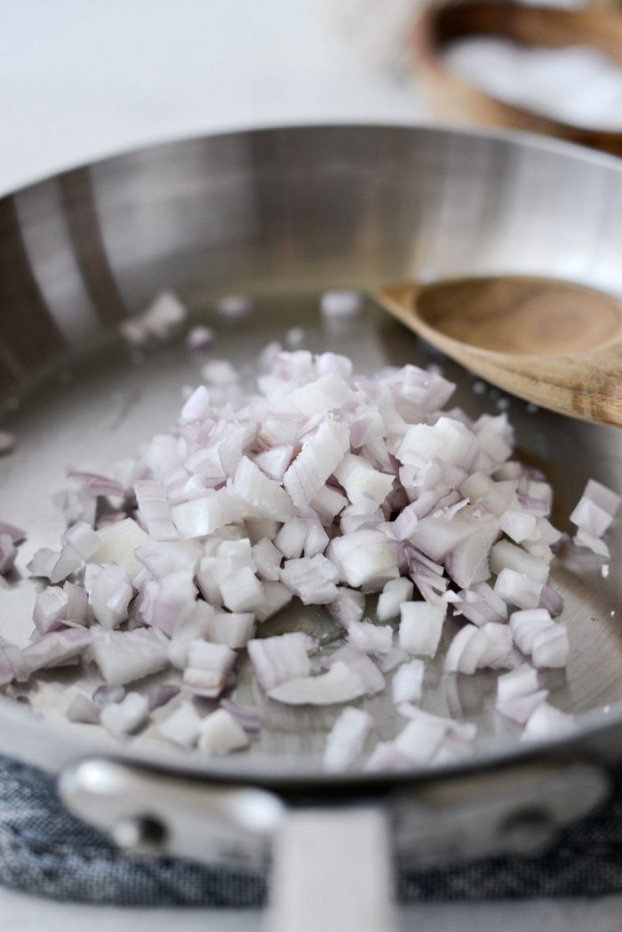 shallots and bacon fat in a skillet