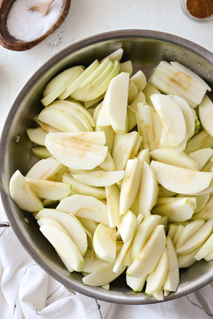 sliced apples added to the skillet.