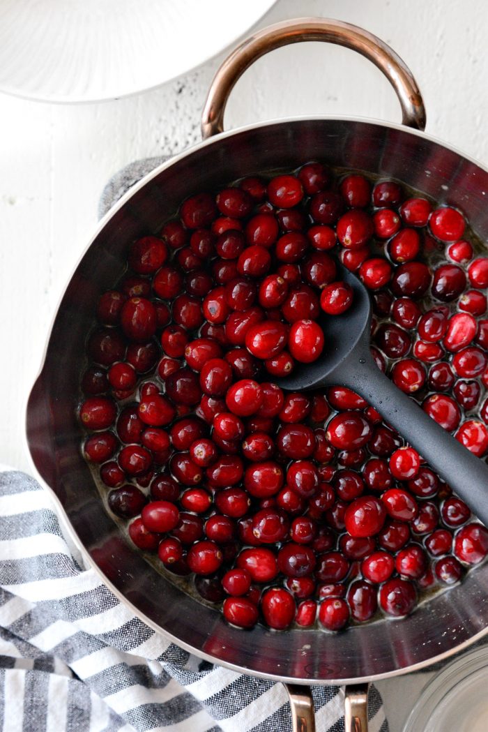 fresh cranberries added to saucepan.