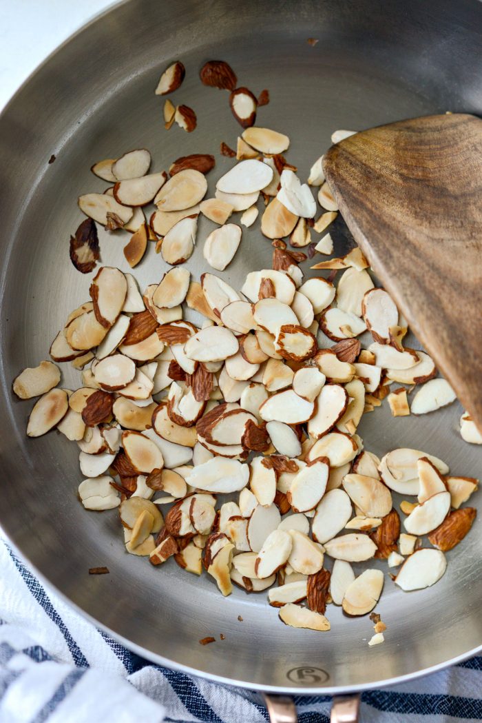 toasted sliced almonds in a skillet.