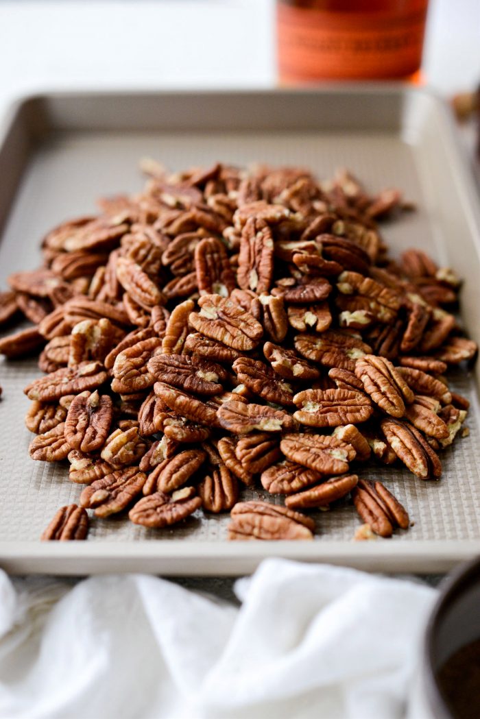 pecans on a rimmed baking sheet.