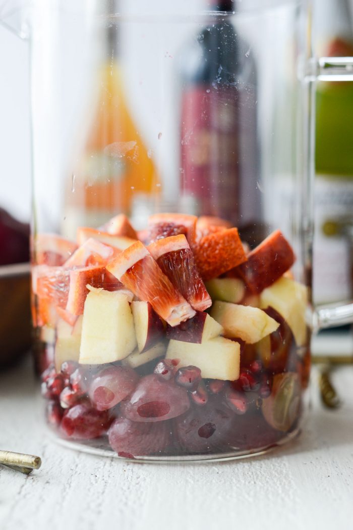 close up of fruit in glass pitcher