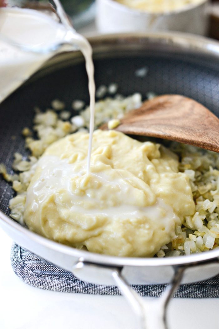 cream of chicken soup and milk added to skillet.