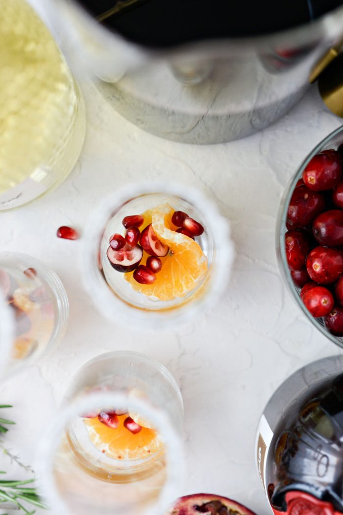 glass with clementine, cranberry and pomegranate arils