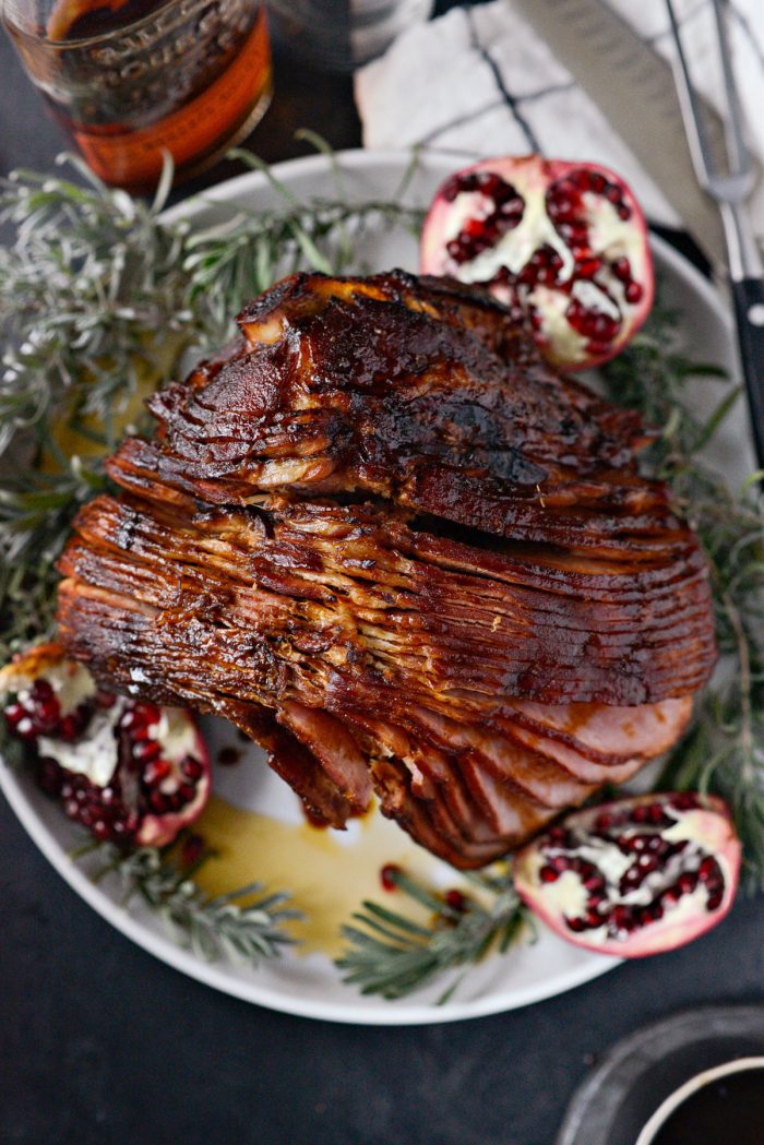 Pomegranate Bourbon Glazed Ham on a white platter.