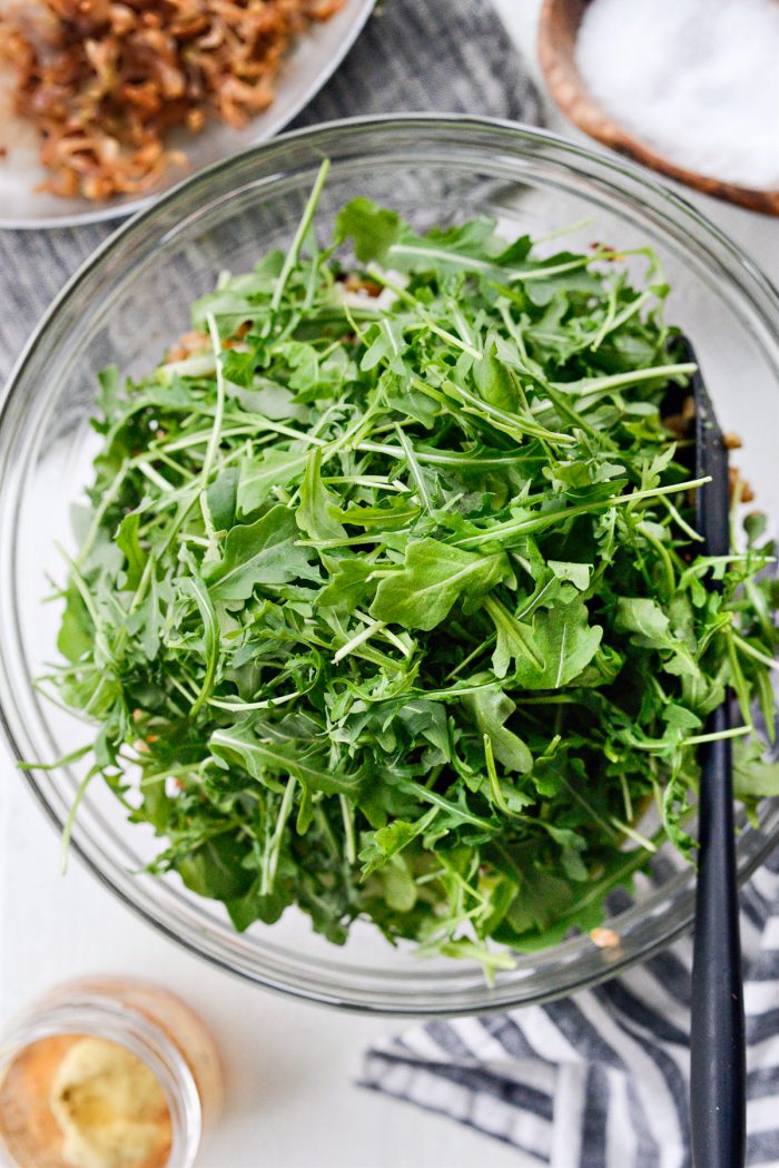 arugula added to bowl