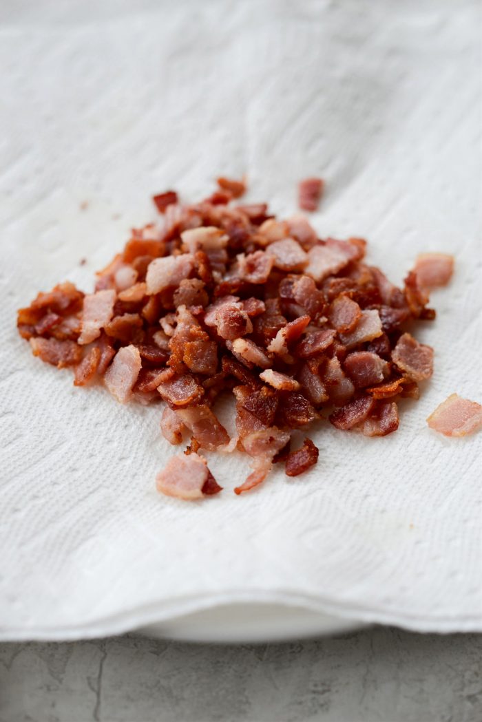 crisped bacon on paper towel lined plate.