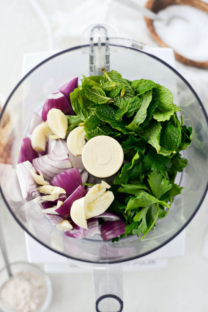 parsley mint, onion, garlic in food processor.