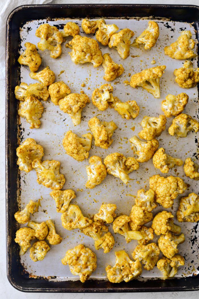 curry cauliflower on roasting pan.