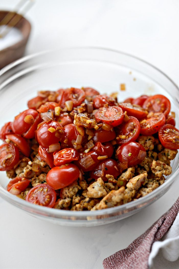 transfer tomato mixture to bowl with sausage.