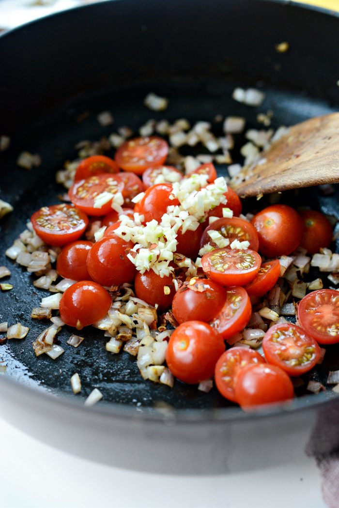 garlic, tomatoes and red pepper flakes added to shallots.