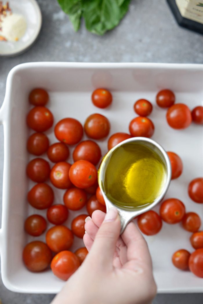 pouring olive oil over top