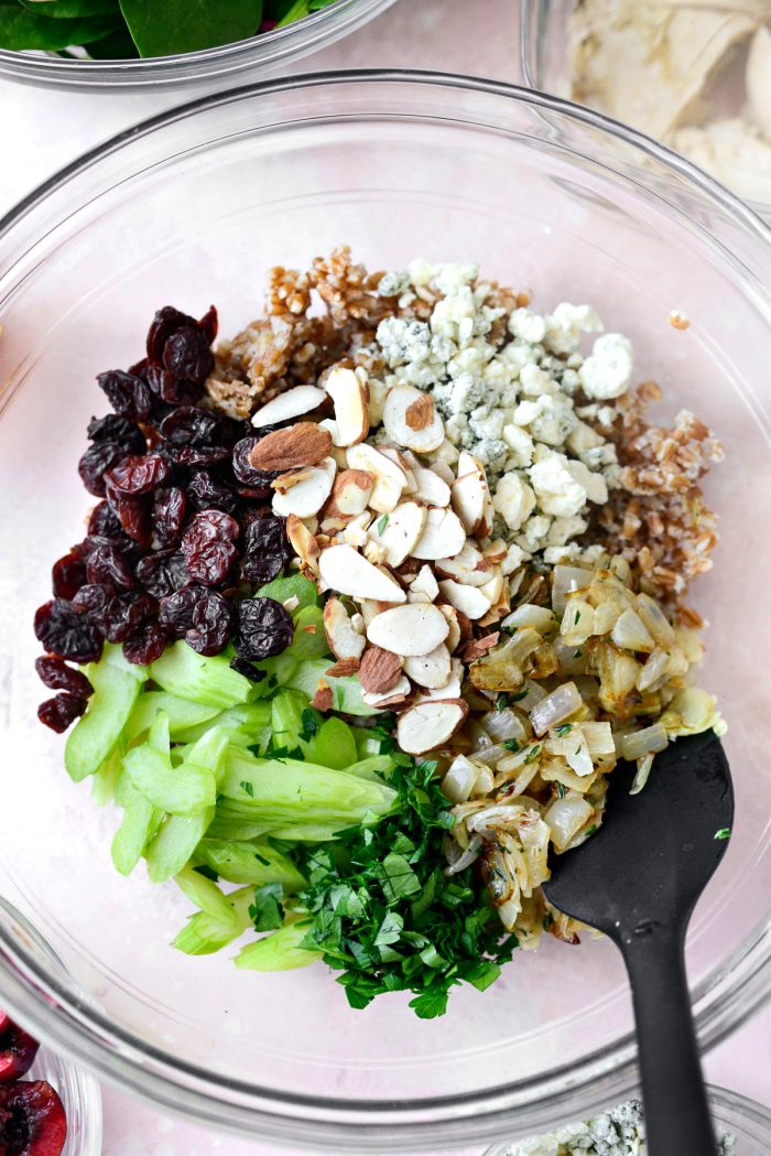 In a bowl add wheat berries, sauteed onions, blue cheese, dried cherries, sliced almonds, parsley