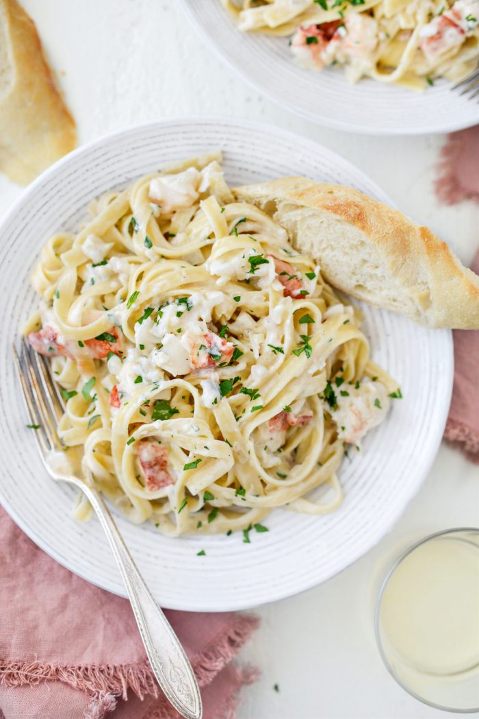 Garlicky Lobster Fettuccine Alfredo with crusty bread and wine.