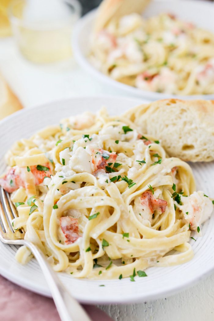 white bowl of Garlicky Lobster Fettuccine Alfredo