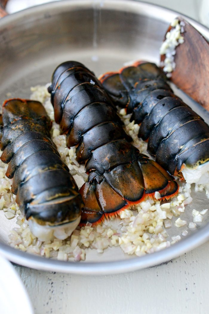 add lobsters to sauteed garlic and shallot.