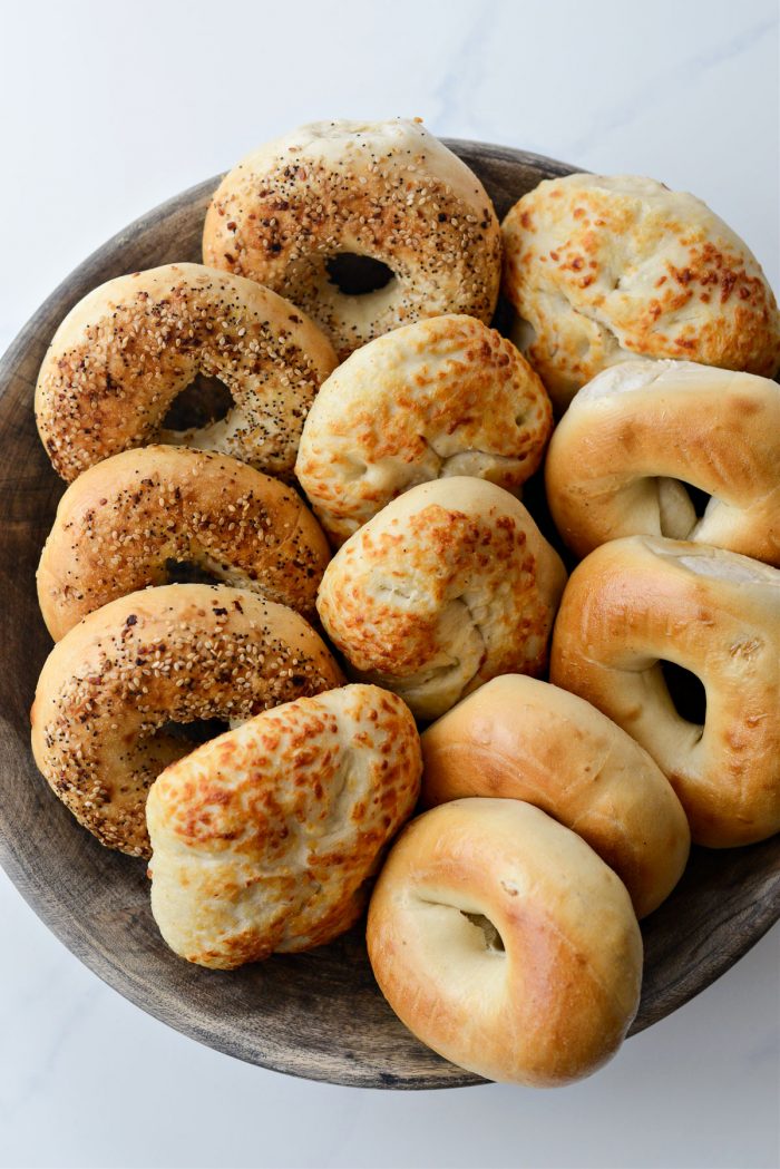 assorted bagels in wood bowl