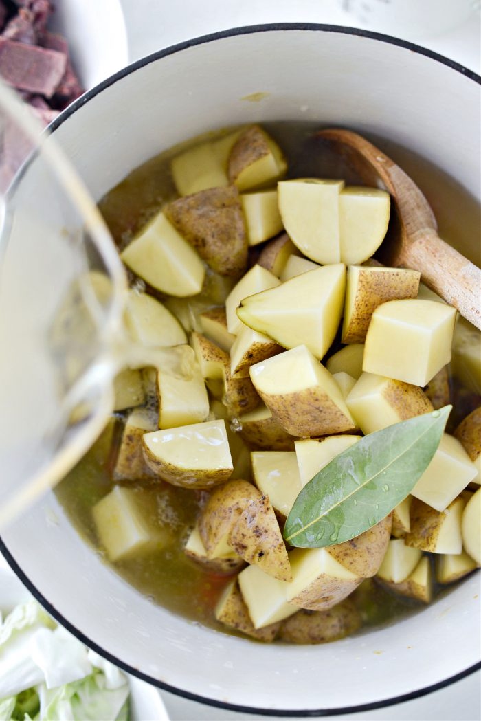 potatoes, bay and broth to pot.