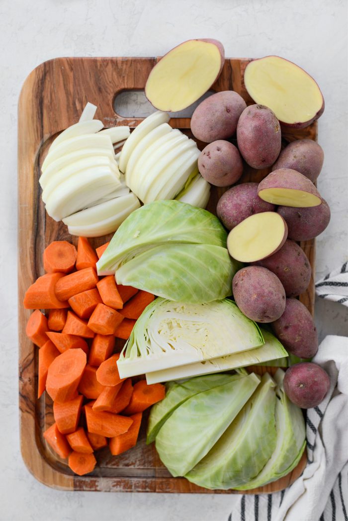 prepped carrots, onions, potatoes and cabbage