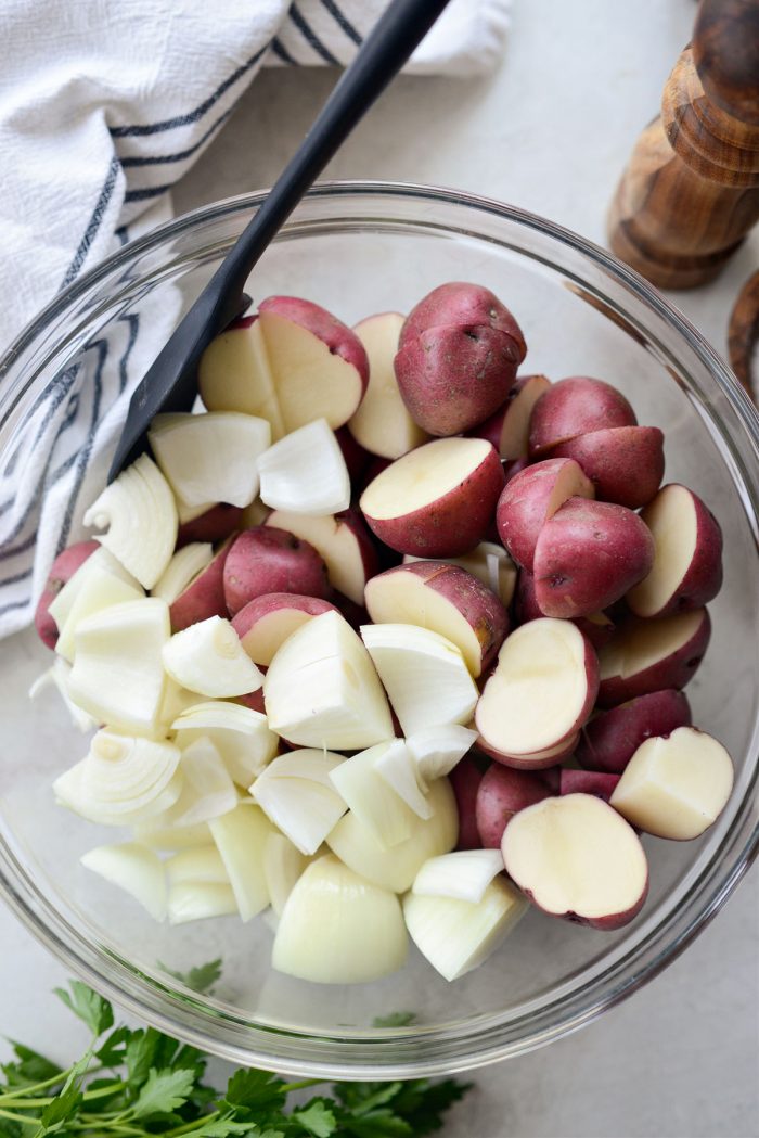 add redskin potatoes and chopped onion to bowl