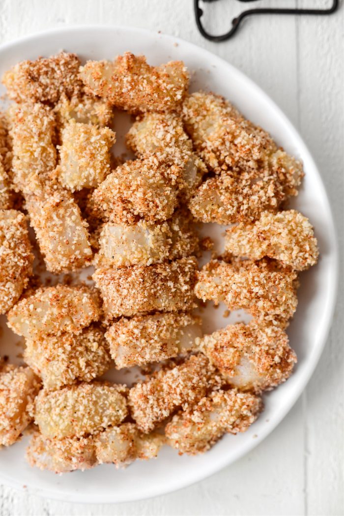 breaded cod on white plate