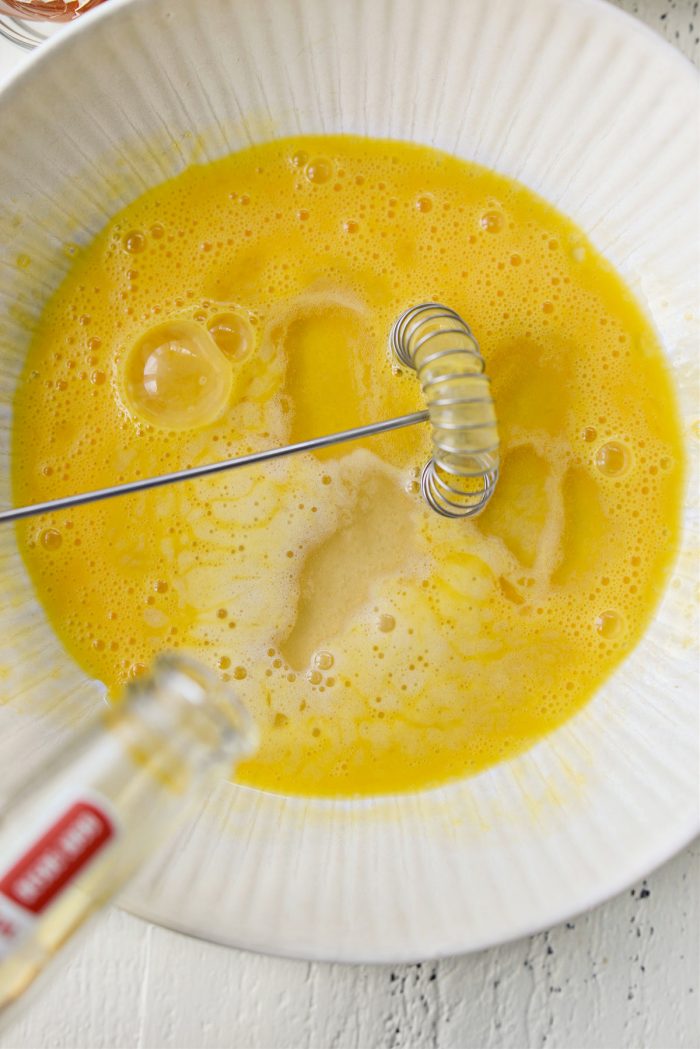 beer pouring into beaten eggs