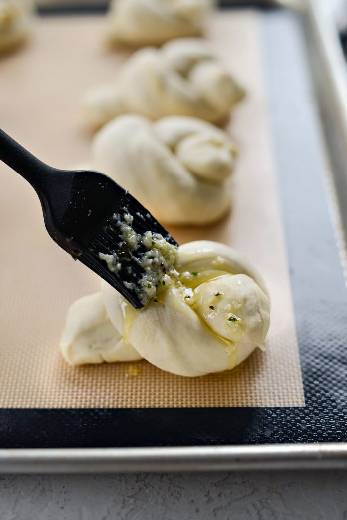 brush garlic herb butter on knots