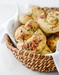 basket of Easy Homemade Garlic Herb Knots